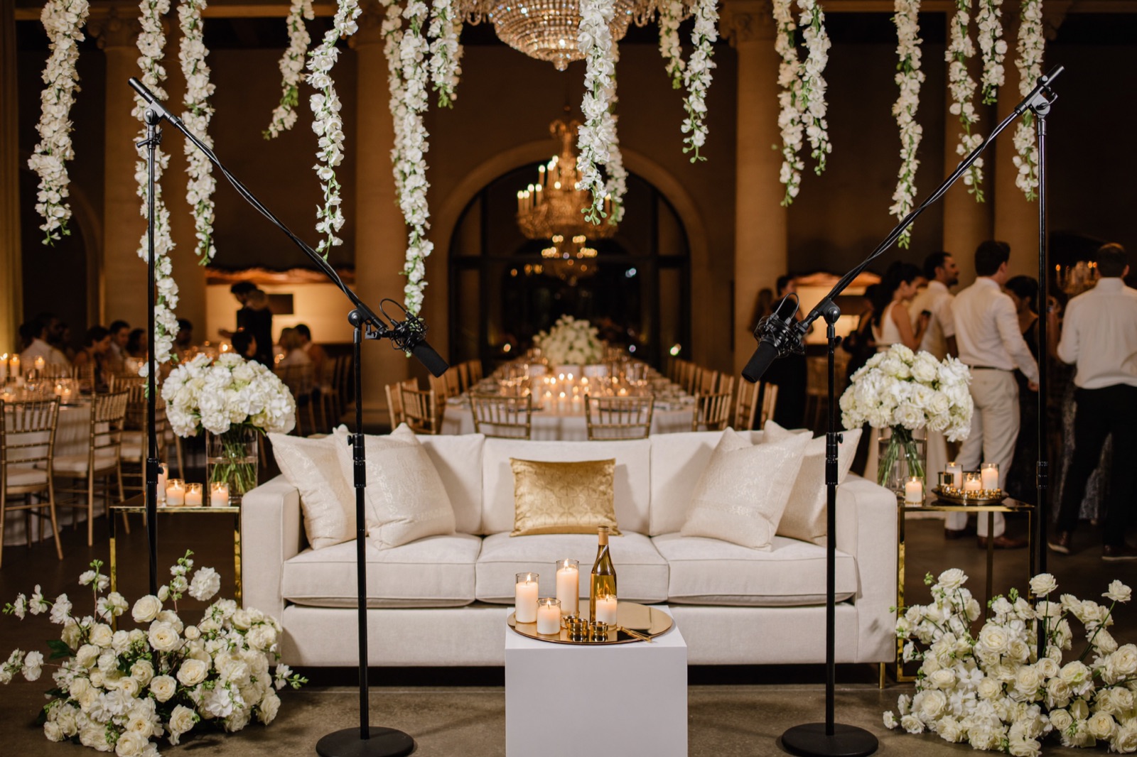 Opulent ballroom podcast set beneath a crystal chandelier
